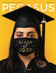 A graduate wears a cap, gown, necklace that says "Brave, and a black mask with "Class of 2020" in glittery letters.
