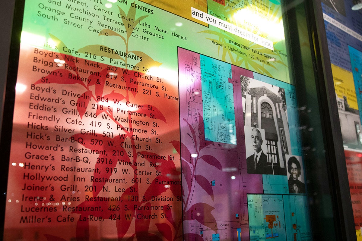Stained glass collage listing the names and address of businesses in Parramore.