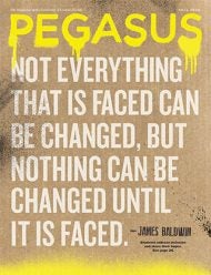 A quote from author and activist James Baldwin is spraypainted on a cardboard background: "Not everything that is faced can be changed, but nothing can be changed until it is faced."