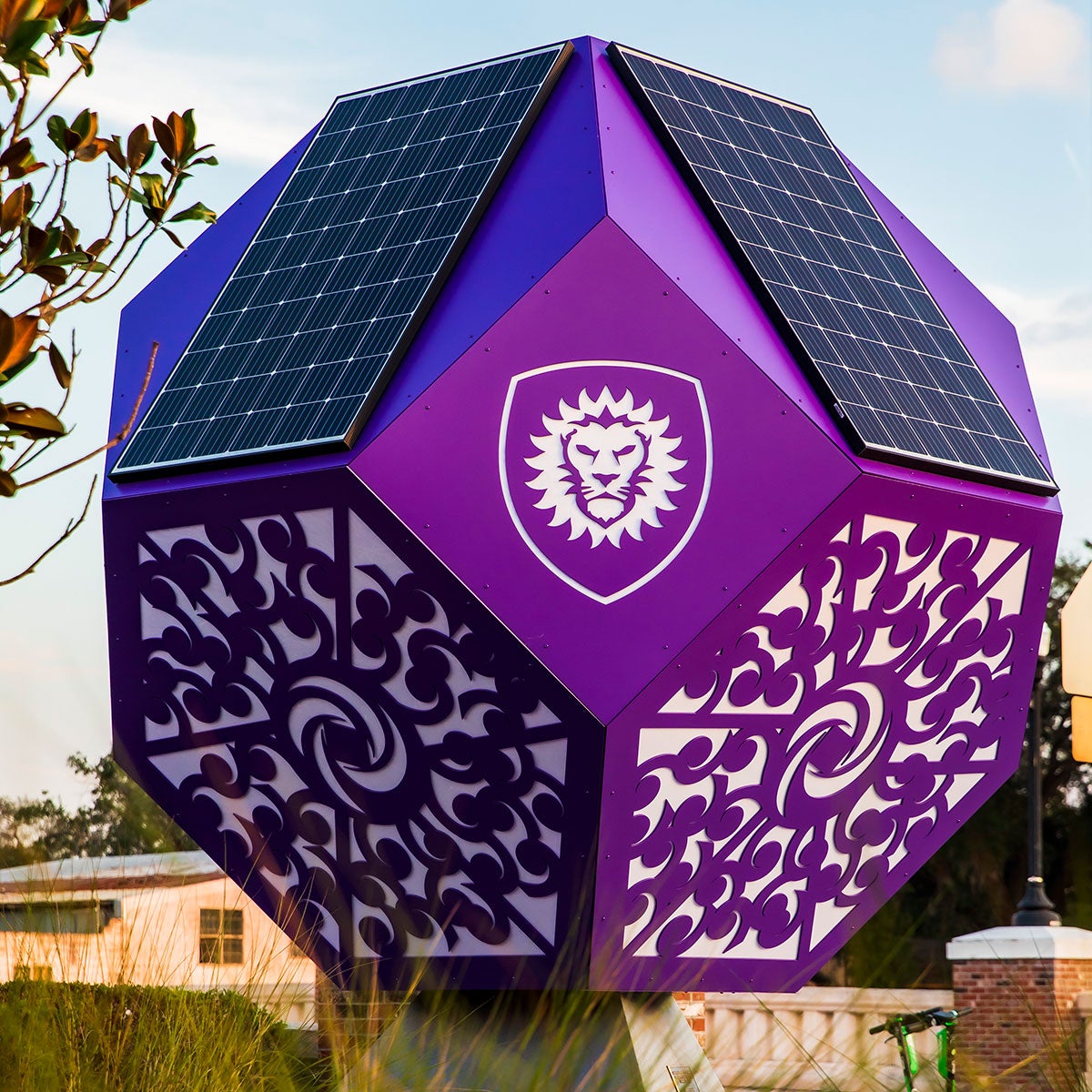 Two solar panels and intricate designs on the solar sculpture.