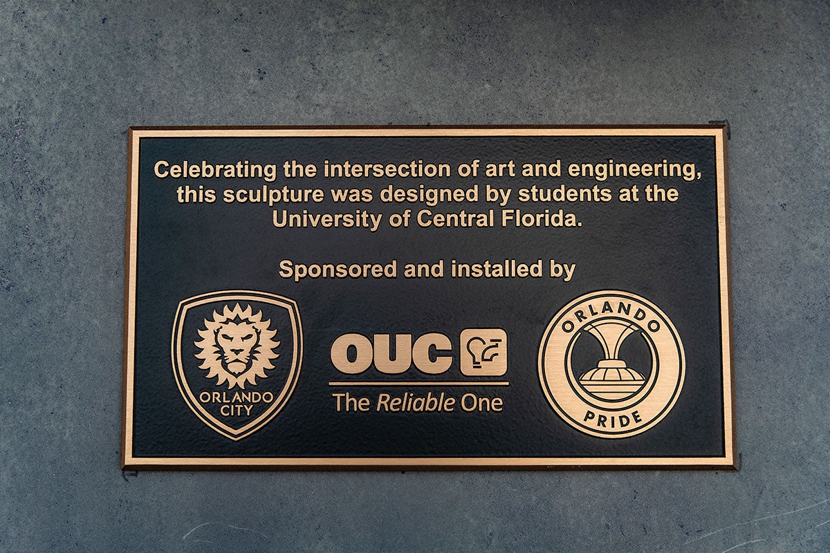 A plaque that honors the students who worked together on the solar sculpture. 