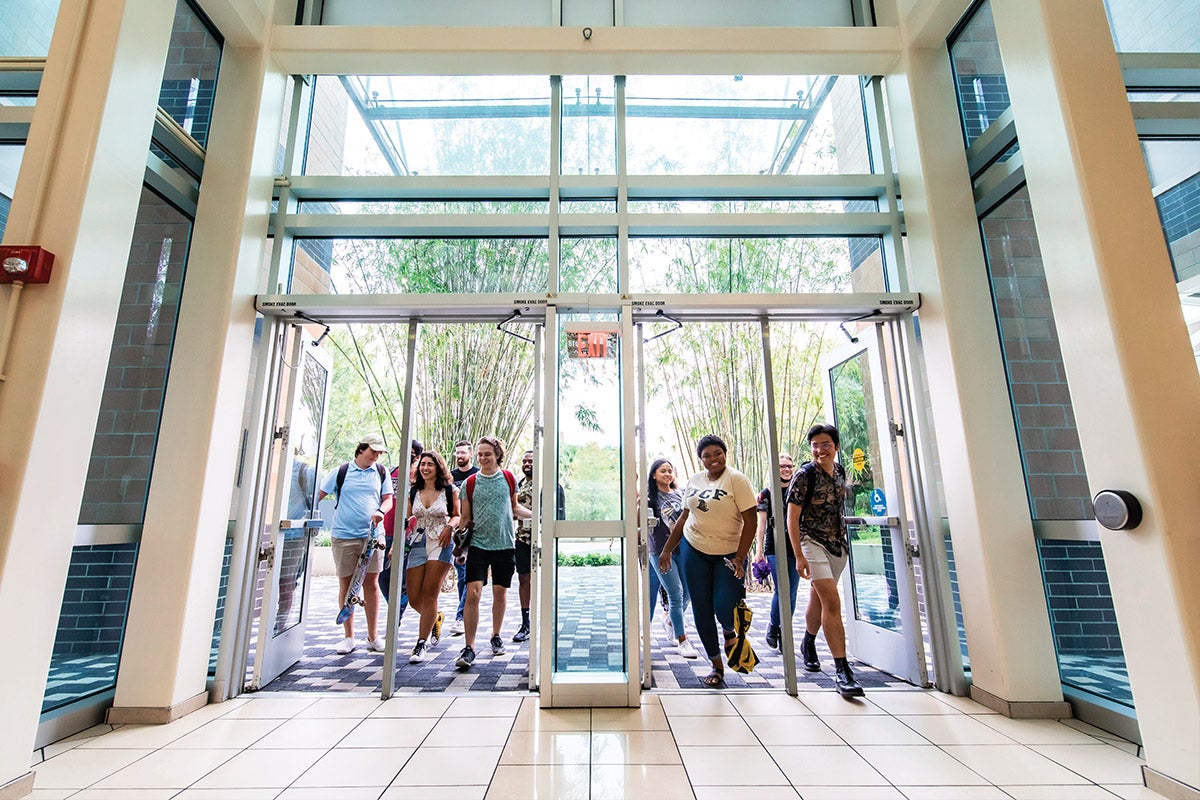 Students enter a building