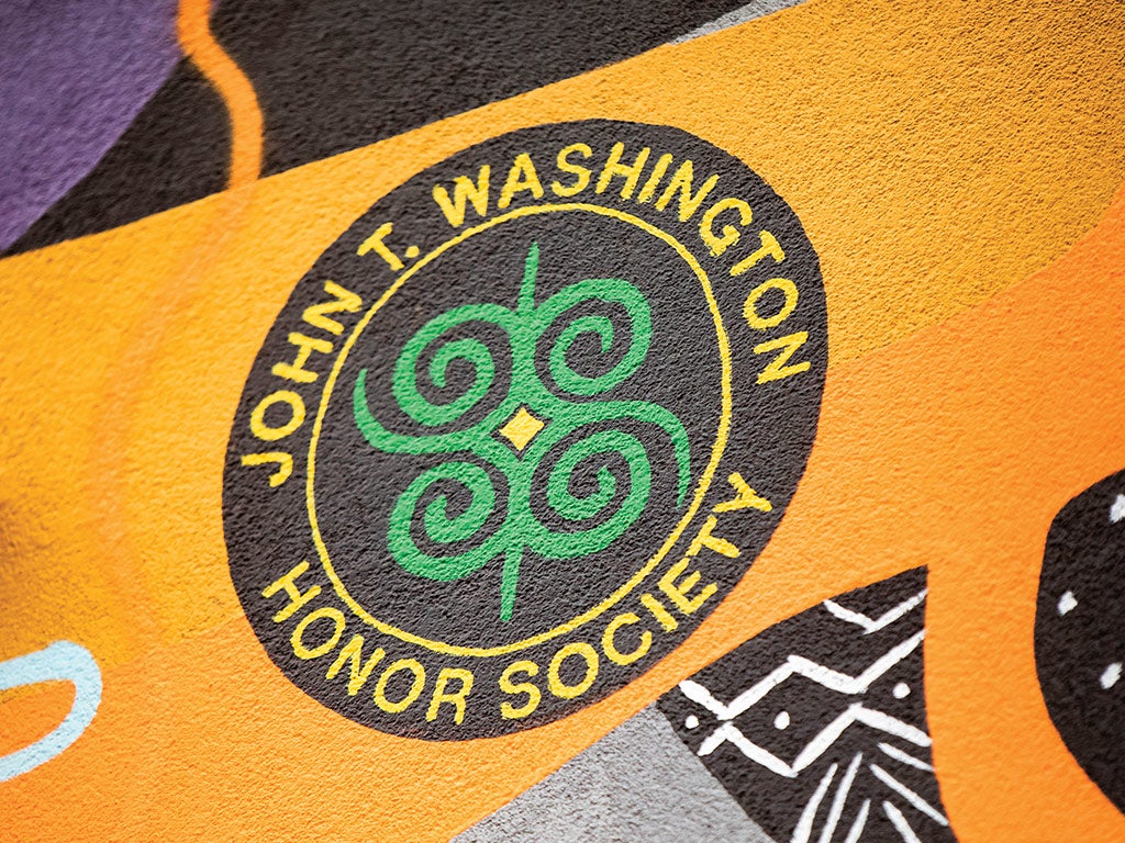 The John T. Washington Honor Society emblem