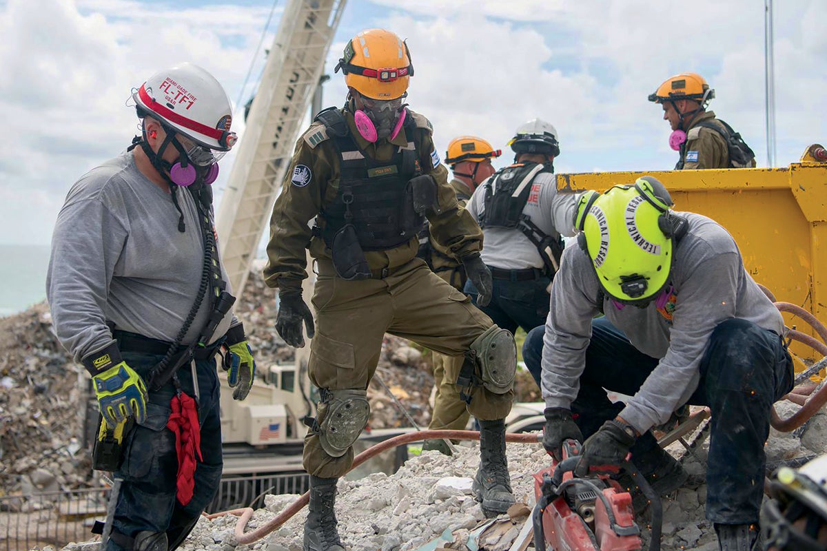 First responders at the Surfside collapse. First responders at the Surfside collapse.