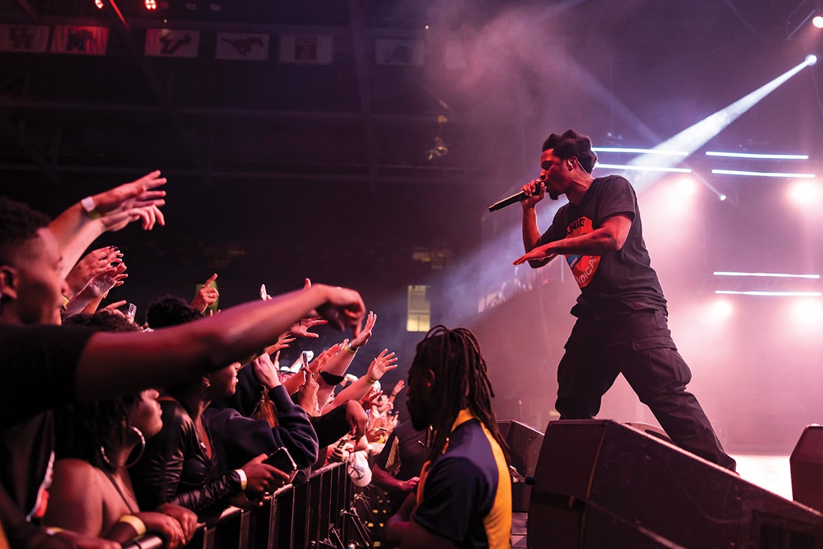 Denzel Curry raps in front of a crowd.