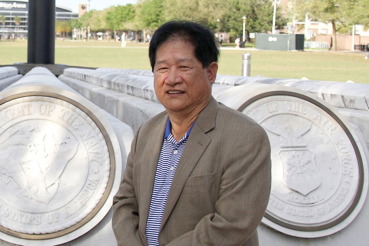 A portrait of George Tunaya ’03 at Memory Mall.