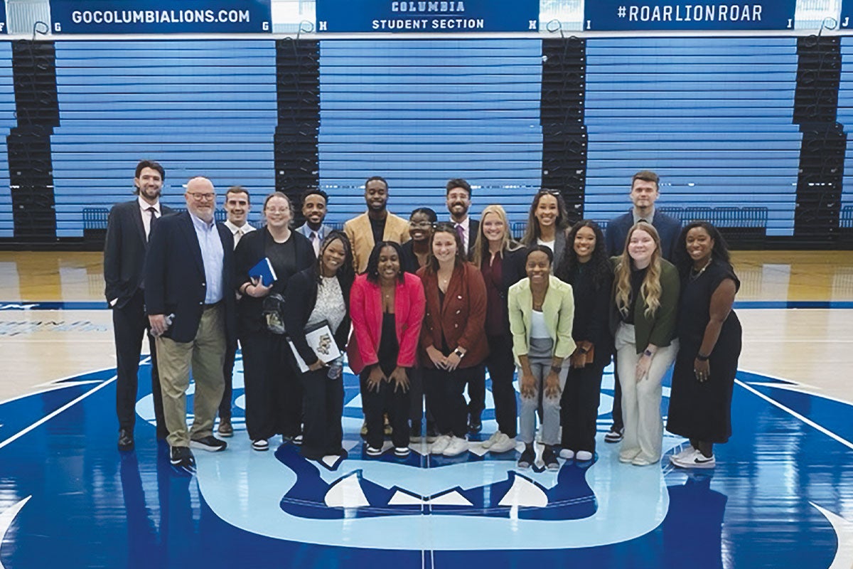 The current cohort of the DeVos Sport Business Management program at the Columbia University basketball arena.