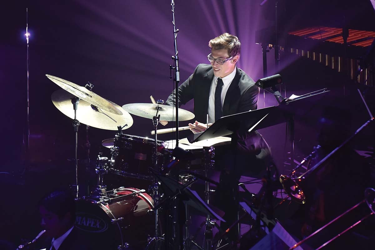 UCF's Flying Big Horse Band drummer beats drum seat as he performs during UCF Celebrates the Arts