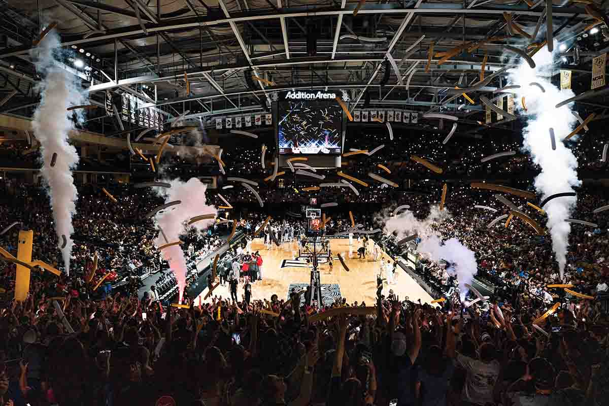 Crowd of fans cheer on the Knights during a men's basketball game in Addition Financial Arena.