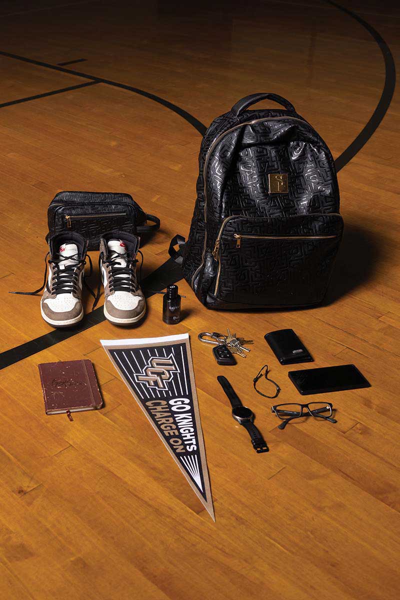 Items in Anthony's bag include his wallet, keys, notebook, bottle of cologne, smartwatch, sneakers and more.