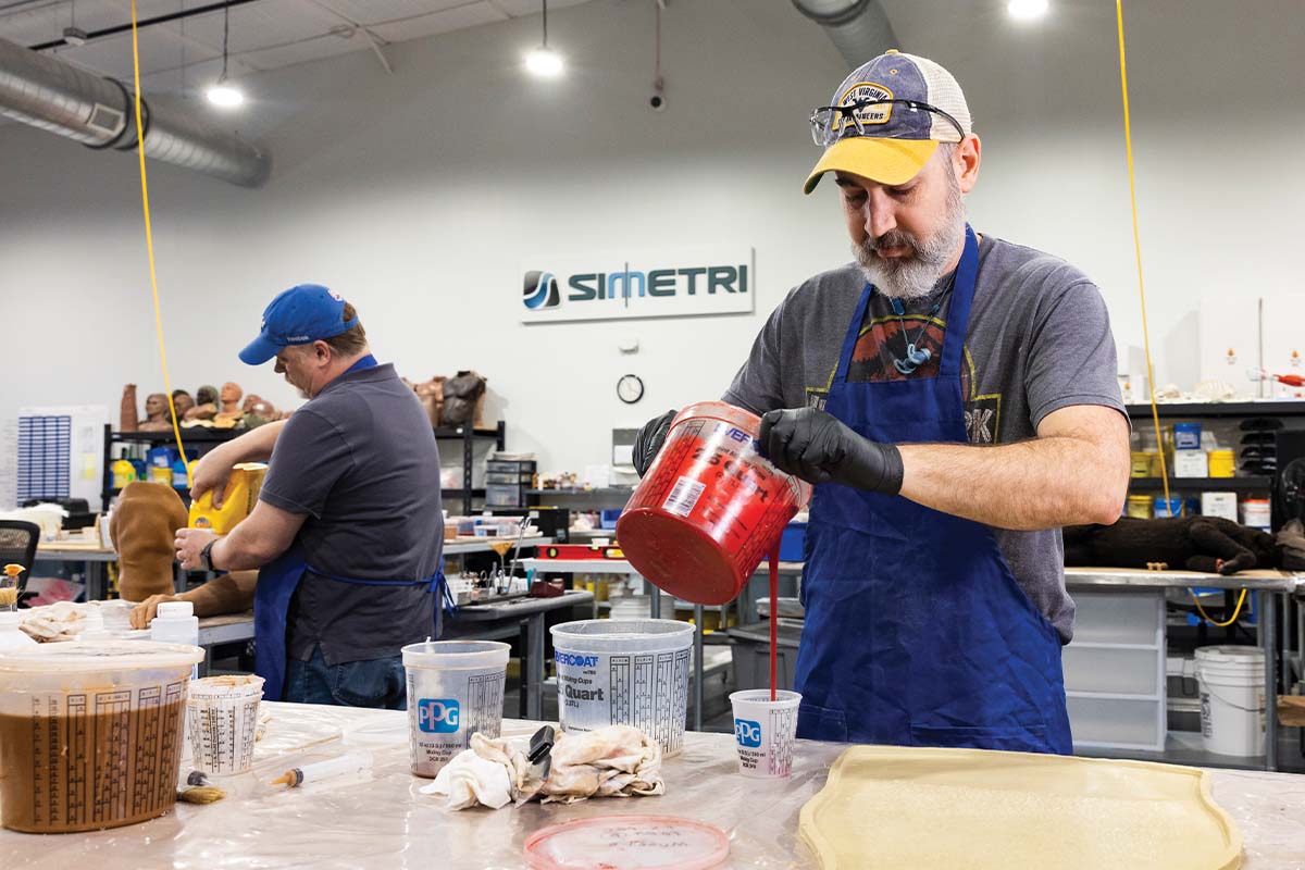 Blayne Weir mixes a silicone base in the SIMETRI lab