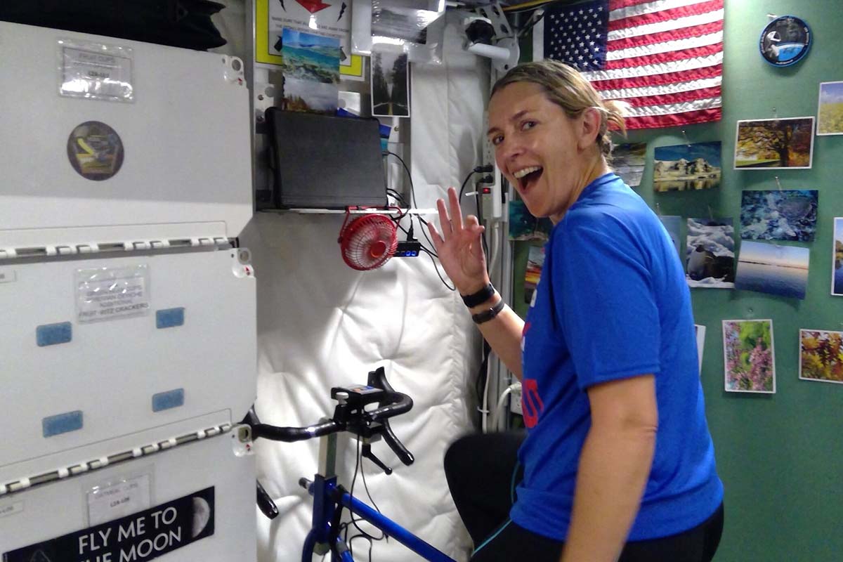 Tiffany Snyder exercises on a space bike inside the HERA habitat.
