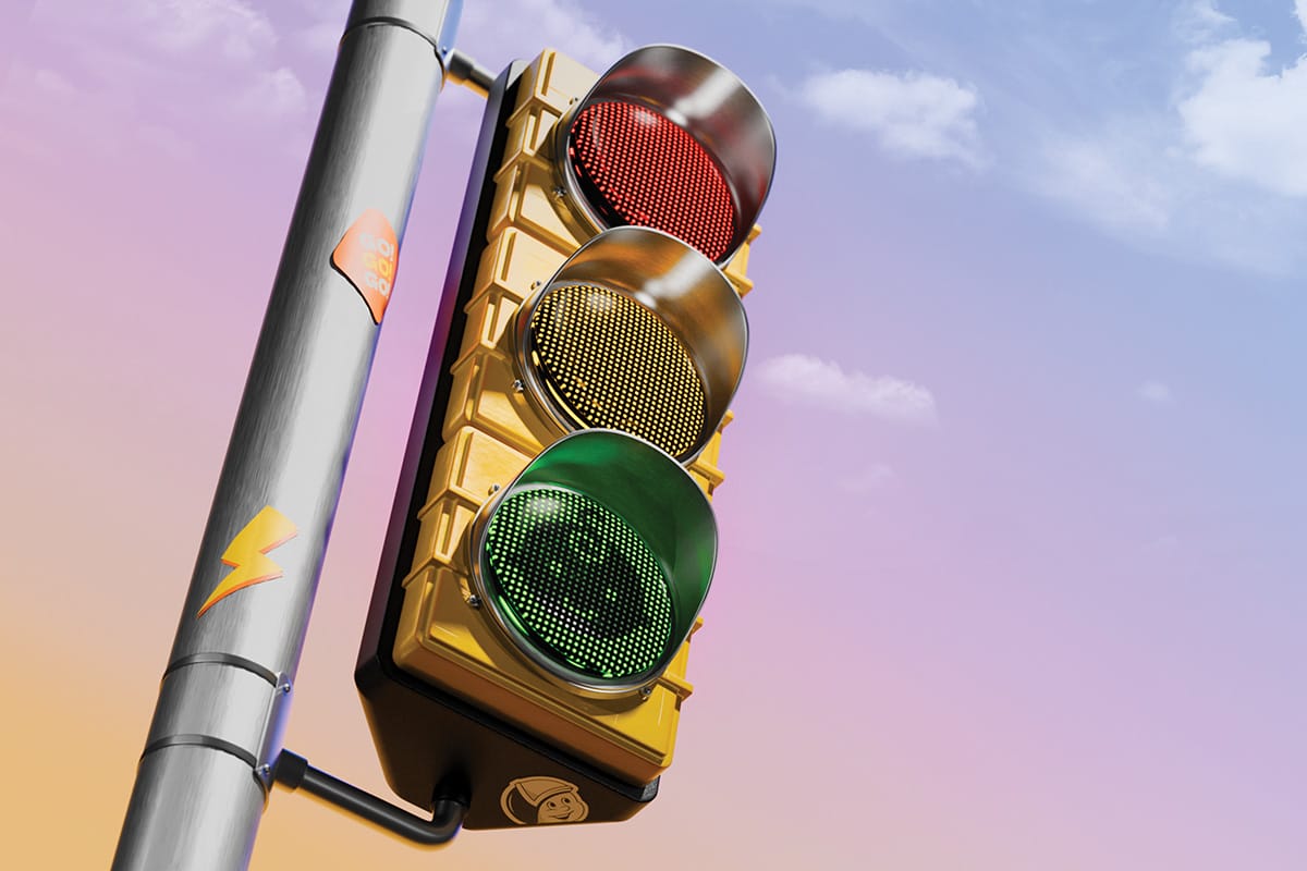 A stoplight with a baby icon on the "Go" green light.