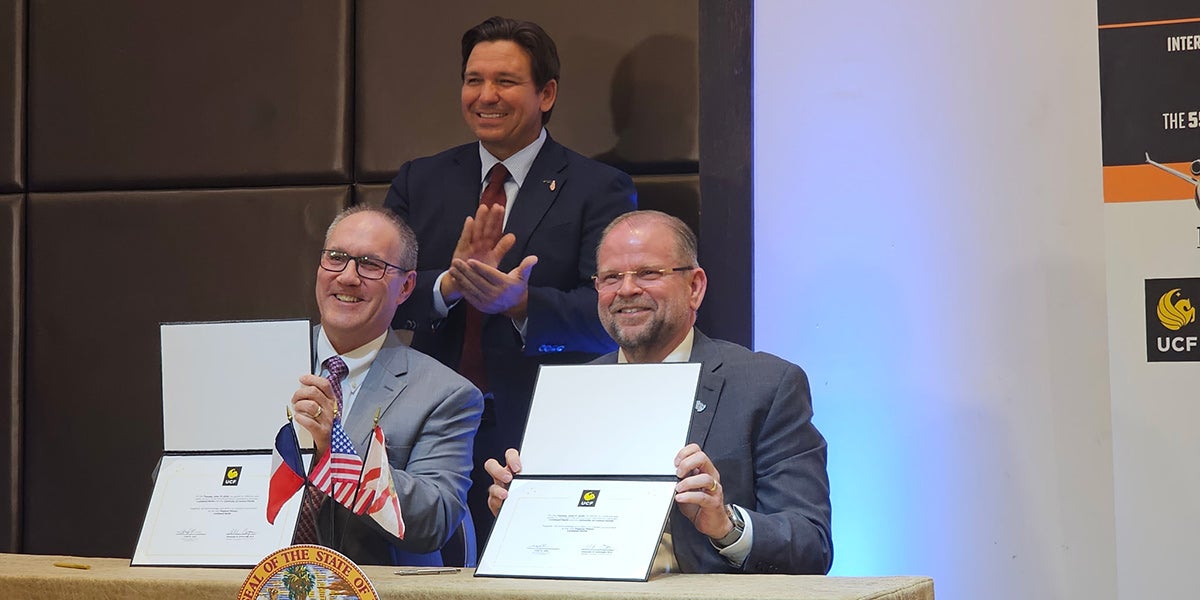 Gov. Ron DeSantis joins two-time UCF alumnus and Lockheed Martin Chief Operating Officer Frank St. John and UCF President Alexander N. Cartwright to celebrate the new Pegasus Partnership.