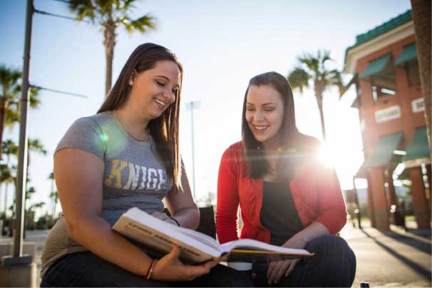 Two students studying a textbook