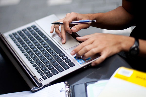 Person typing on a laptop